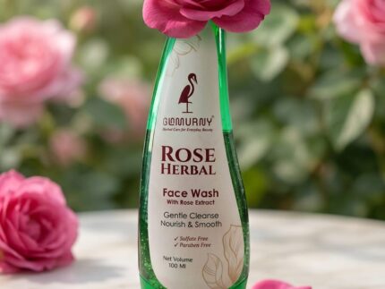 GLAMURNY Rose Herbal Face Wash 100ml bottle with fresh pink rose flower and petals, natural rose extract herbal face wash for gentle cleansing and smooth glowing skin.