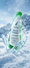 GLAMURNY Blue Herbal Face Wash bottle surrounded by ice crystals and snow, representing refreshing herbal skincare, gentle cleansing and cool skin hydration.