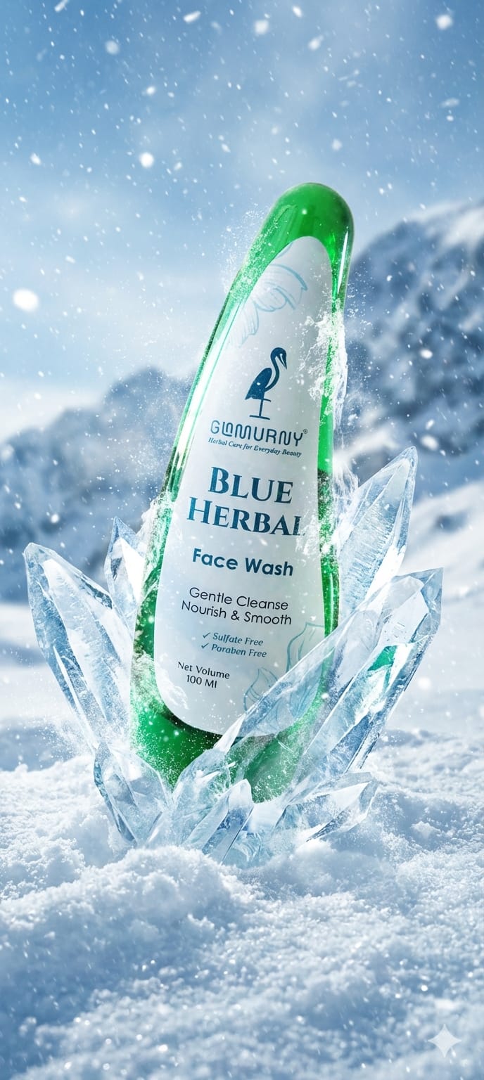 GLAMURNY Blue Herbal Face Wash bottle surrounded by ice crystals and snow, representing refreshing herbal skincare, gentle cleansing and cool skin hydration.